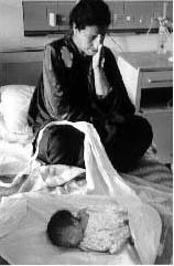 Iraqi mother with dead child