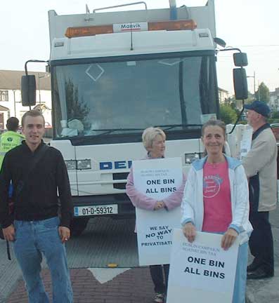 Garbage truck and protesters